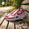 Side view of Snoopy Peanuts Custom Air Force 1 Sneakers resting on a wooden park bench.