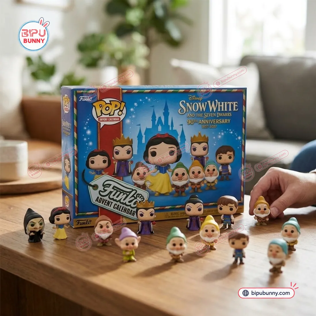Freestanding 3D molded miniature vinyl figures of Snow White, the Seven Dwarfs, the Evil Queen, and the Prince arranged on a wooden coffee table