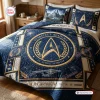 Front view of blue Star Trek Starfleet Academy bedding set with gold insignia and star charts.
