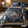 Front view of a blue and gold Star Trek Starfleet Academy Bedding Set on a wooden bed frame.