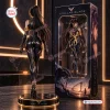 Back view of Stellar Blade Eve vinyl figure statue standing on a round lit base next to its packaging box.