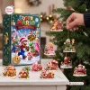 Front view of Super Mario Christmas Advent Calendar box with holiday figurines displayed on a table and hanging on a tree.
