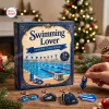 Front view of the Swimming Lover Advent Calendar 2026 box with swimming pool graphics and acrylic ornaments.