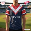 Front view of the Sydney Roosters 2026 NRL Premiers Baseball Jersey worn in a stadium setting.