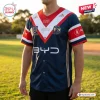 Front view of the Sydney Roosters 2026 NRL Premiers Baseball Jersey worn outdoors.
