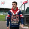 Man wearing Sydney Roosters 2026 Premiers rugby hoodie at sports stadium.
