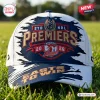 Front view of the Sydney Roosters NRL Premiers 2026 Cap resting on green grass.