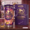 Front view of the Taco Bell 65th Anniversary Handle Tumbler with purple and orange tie-dye design.