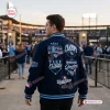 Back view of a man wearing a dark blue Tampa Bay Rays 2026 World Series Baseball Jacket with championship patches.