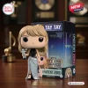 Front view of a Taylor Swift 2026 MTV VMA Vinyl Figure holding a silver award next to its box.