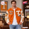 Front view of a man wearing a Tennessee Volunteers chenille patch varsity baseball jacket in orange and white.