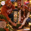 Man and woman installing a Texas Longhorns Stadium Solar Garden Light outdoors.