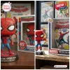 Front view of The Amazing Spider-Man 65th Anniversary Vinyl Figure standing next to its collectible packaging box.