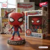 Front view of The Amazing Spider-Man 65th Anniversary Vinyl Figure outside its box with web shooting effect.