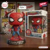 Front view of The Amazing Spider-Man 65th Anniversary Vinyl Figure with box and comic books.