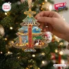 Close-up of The Beach Boys 65th Anniversary Christmas Ornament hanging on a tree.