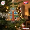 Hanging tree-shaped The Beach Boys 65th Anniversary Christmas Ornament on a lit pine tree.