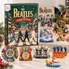 Front view of The Beatles Christmas Advent Calendar box with miniature figurines and ornaments arranged on a surface.
