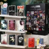 Front view of The Cure cassette tape advent calendar box displayed with nine individual cassette tapes on shelves.