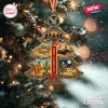 Front view of The Eagles 55th Anniversary Christmas Ornament hanging on a pine tree.