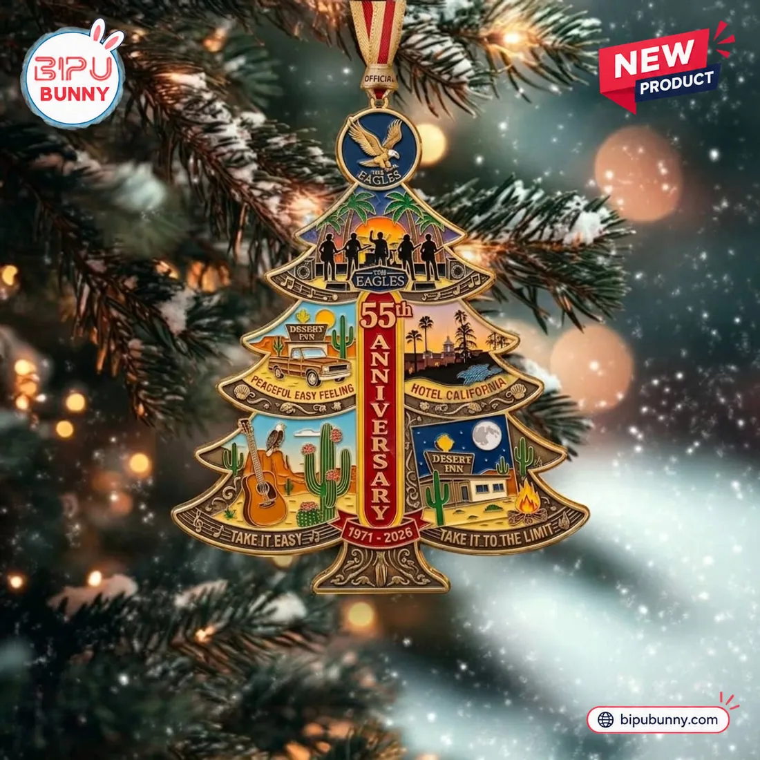 Front view of The Eagles 55th Anniversary Christmas Ornament hanging on a lit Christmas tree, displaying all four song panels and the 1971-2026 trunk