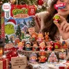 Close-up of The Grinch Christmas 2026 Advent Calendar box and miniature holiday figures.