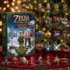 Front view of The Legend of Zelda Hyrule Legends 2026 Advent Calendar box alongside various hanging character ornaments.