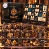 Front view of The Mummy 1999 Hamunaptra Advent Calendar with open boxes and twenty-four figurines displayed on stone steps.