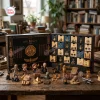 Front view of The Mummy 1999 Hamunaptra Advent Calendar with open numbered drawers and small figurines on table.