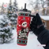 Gloved hand holding a red Stanley tumbler featuring holiday character graphics and the text Sorta Merry Sorta Spooky.
