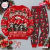Front view of The Rolling Stones 2026 Christmas sweater and plaid pants set with band member graphics.