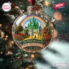 Hanging glass sphere ornament featuring figures on a yellow brick road with The Wizard Of Oz 87th Anniversary text.