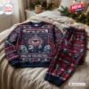 Front view of the Tool Band Christmas Sweater and Jogger Pants Set laid on a bed with holiday decor.