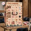 Front view of Top Corner Pink Handball Advent Calendar 2026 featuring 24 numbered doors and holiday illustrations.