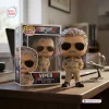 Front view of Top Gun Viper Tom Skerritt collectible vinyl figure next to its box on a desk.