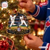 Hands hanging a Toronto Blue Jays Joe Carter Christmas Ornament on a tree.