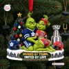 Front view of a Toronto Maple Leafs x Montreal Canadiens Grinch Christmas Ornament on a tree.