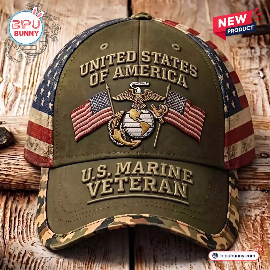 Overhead front close-up of the US Marine Veteran Embroidered Baseball Cap displaying the Eagle Globe and Anchor between crossed American flags and camo brim edge