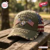 Front view of a US Marine Veteran embroidered baseball cap resting on a wooden bench outdoors.