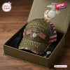 Front view of a US Marine Veteran Embroidered Baseball Cap resting inside a gift box.
