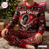 Front view of a person wearing a Van Halen Christmas sweater and pants set featuring a guitarist graphic.
