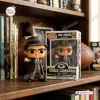 Front view of the Vince Lombardi The Pope 113th Anniversary Vinyl Figure beside its box on a shelf.