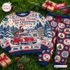Flat lay of Volkswagen x Snoopy Christmas Sweater and Jogger Set on grass.