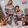 Front view of a couple wearing Volkswagen x Snoopy Christmas Sweater and Jogger Set with festive car and holiday prints.
