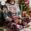 Front view of person wearing a Volkswagen x Snoopy Christmas Sweater and Jogger Set while holding a mug.