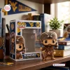 Front view of West Virginia Mountaineers vinyl figure beside its box on a wooden shelf.