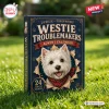 Front view of Westie Troublemakers Christmas Advent Calendar box resting on green grass.