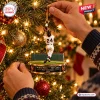 Close-up of Willie Mays New York Giants The Catch Ornament hanging on a lit Christmas tree.