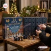 Front view of Wu-Tang Clan 35th Anniversary Advent Calendar with opened drawers and vinyl figures on wooden table.