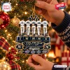Close-up of a Christmas ornament featuring five baseball player figures and Yankee Greatness text hanging on a tree.